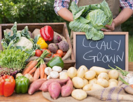 Farmer selling organic veg at market