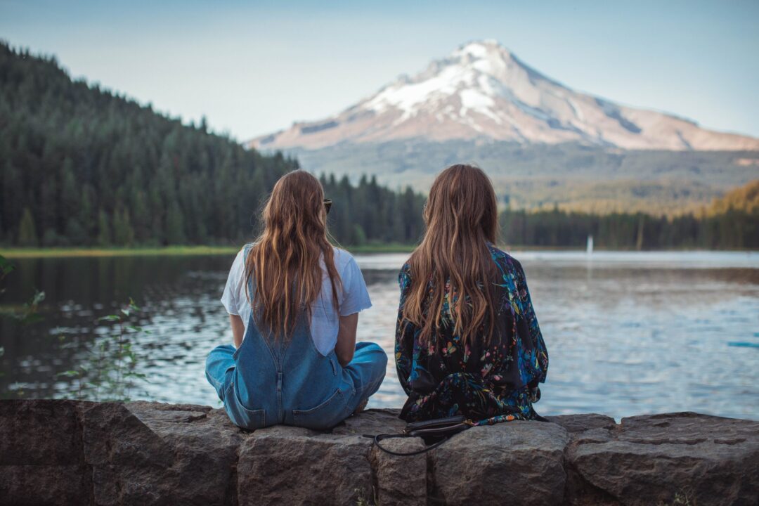 Two girls exploring interesting getaway ideas in Oregon