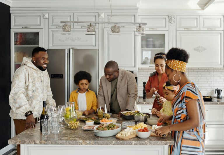 A family preparing dinner and discussing whether to choose Washington or Oregon for your next family relocation